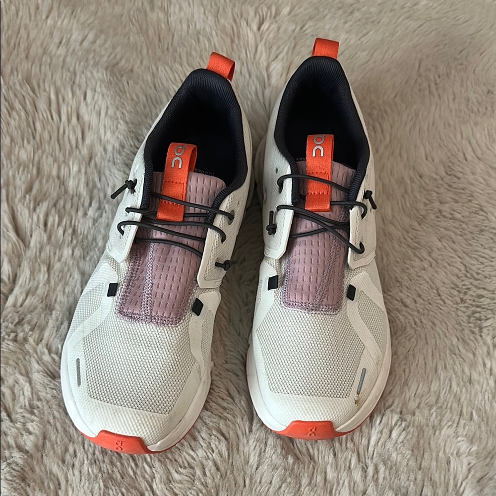 On Running White and Orange Sneakers